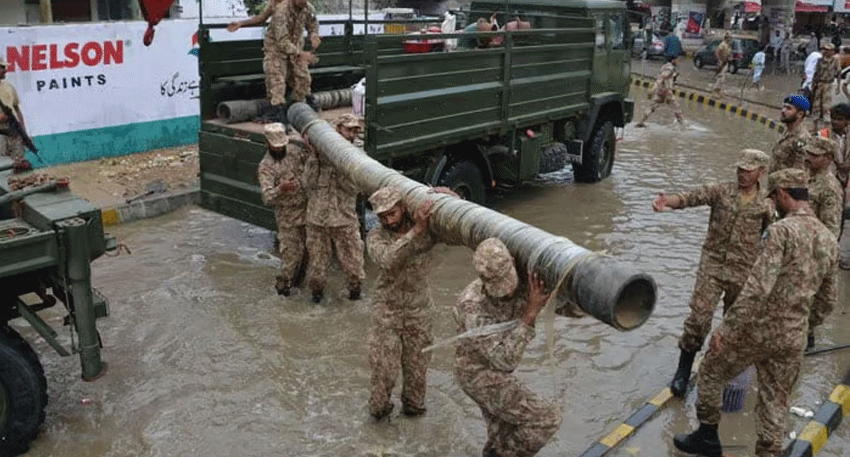Pakistan Army troops assist emergency operations as heavy rain causes flooding concerns in Rawalpindi.