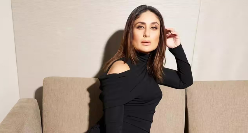 Kareena Kapoor in a black cutout top on a beige sofa.