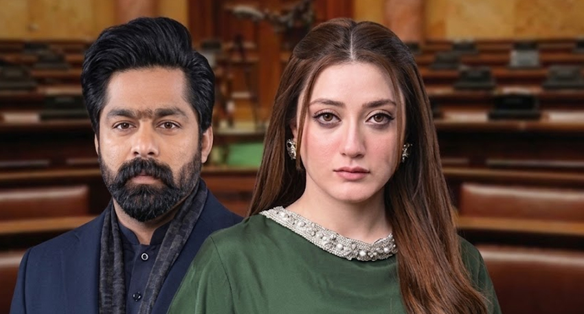 Pakistani actors Momina Iqbal and Saqib Khan Chadhar posing closely against an official assembly backdrop.