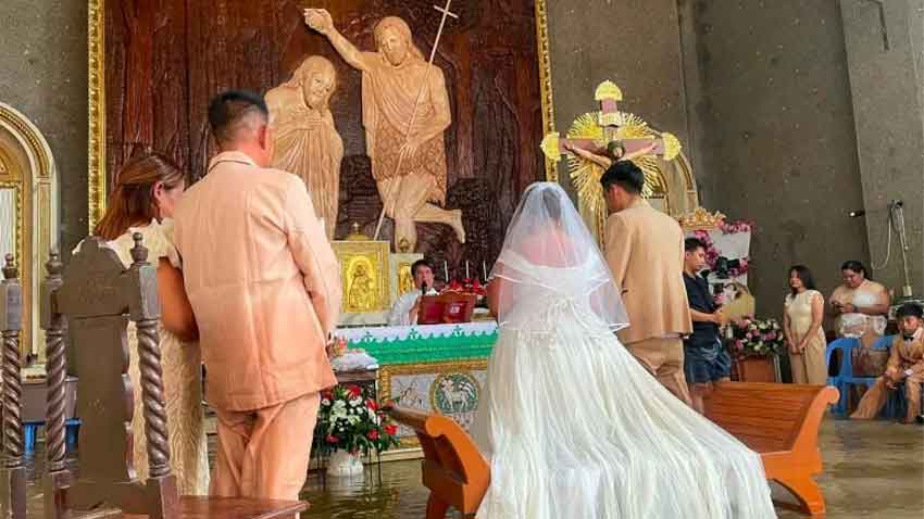 Philippine couple gets married in hip-deep floodwaters as heavy rains continue. File photo