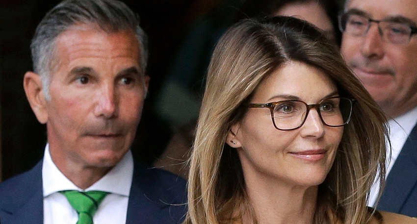 Lori Loughlin and Mossimo Giannulli walking side by side outside.