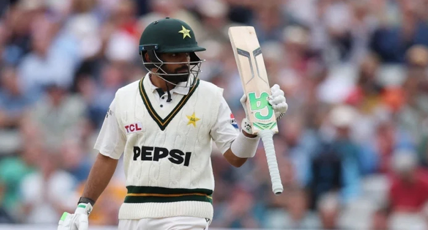Babar Azam raising his bat during a Test match.
