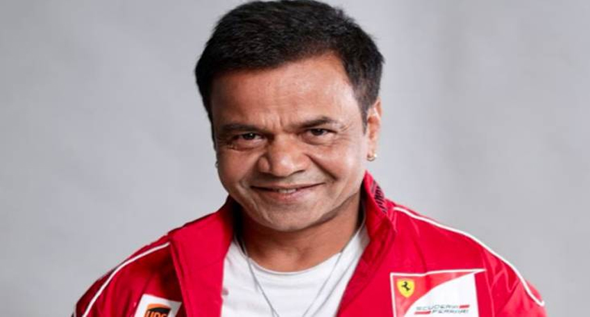 Rajpal Yadav smiling and posing for a picture.