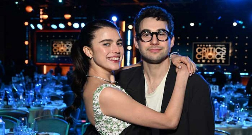Margaret Qualley hugs Jack Antonoff smiling at the Critics Choice Awards.