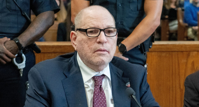 Harvey Weinstein sitting in a Manhattan courtroom during a legal proceeding.